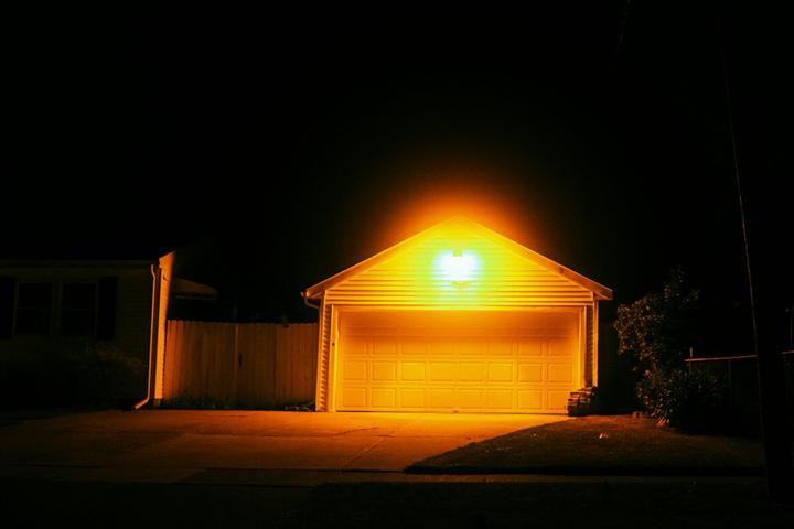 Garage under a floodlight at night